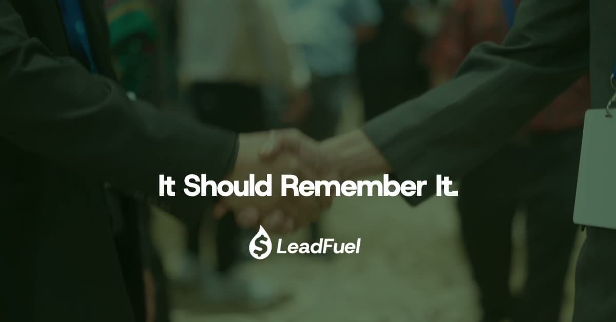 A robot greeting visitors at a booth gives way to two people shaking hands beneath the line “AI shouldn't work the booth. It should remember it.”